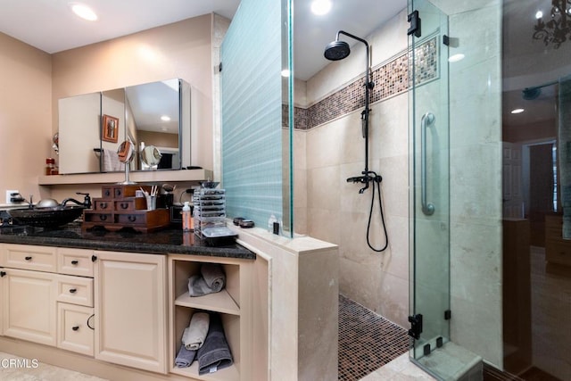 bathroom featuring a stall shower and vanity