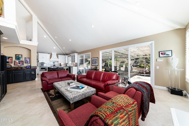 living area with light tile patterned floors, high vaulted ceiling, baseboards, and recessed lighting