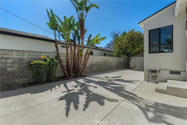 view of patio / terrace featuring a gate and fence