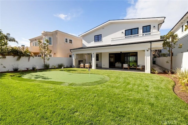 1820 9th St, Manhattan Beach, CA 90266 - back of property featuring outdoor lounge area, a fenced backyard, a patio area, and a balcony