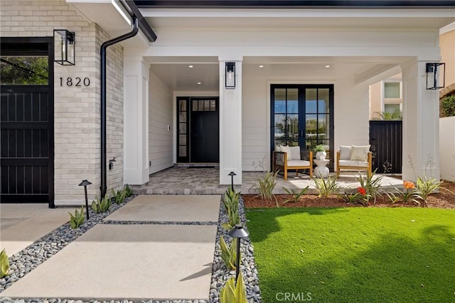 1820 9th St, Manhattan Beach, CA 90266 - property entrance with brick siding, a porch, and a lawn