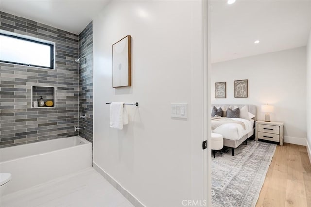 1820 9th St, Manhattan Beach, CA 90266 - full bath with bathing tub / shower combination, ensuite bath, toilet, wood finished floors, and baseboards