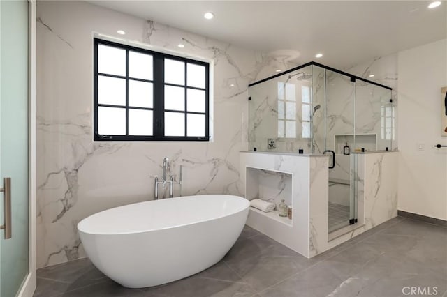 1820 9th St, Manhattan Beach, CA 90266 - bathroom with a soaking tub, recessed lighting, marble finish floor, tile walls, and a marble finish shower