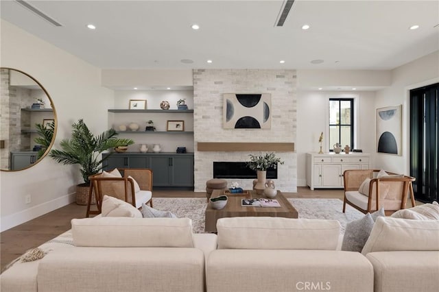 1820 9th St, Manhattan Beach, CA 90266 - living area with recessed lighting, a large fireplace, baseboards, and wood finished floors