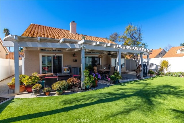 rear view of property with a chimney, fence, a yard, a patio area, and a pergola