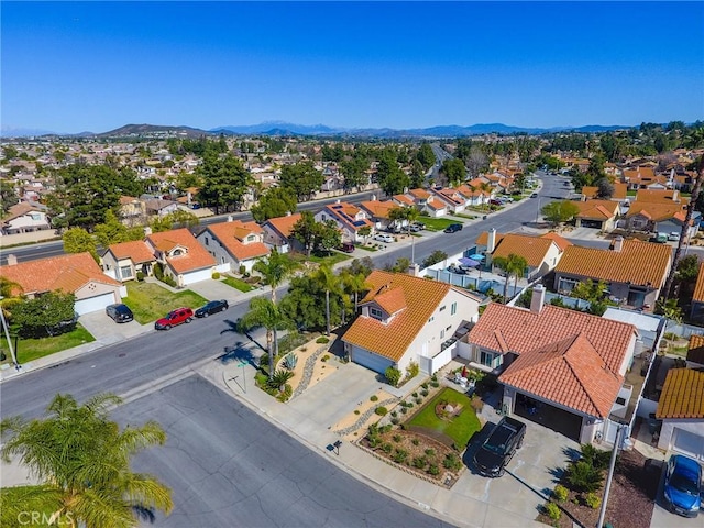 birds eye view of property with a residential view and a mountain view