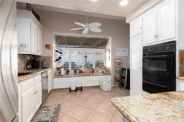 kitchen with light tile patterned floors, dobule oven black, decorative backsplash, white cabinetry, and dishwasher