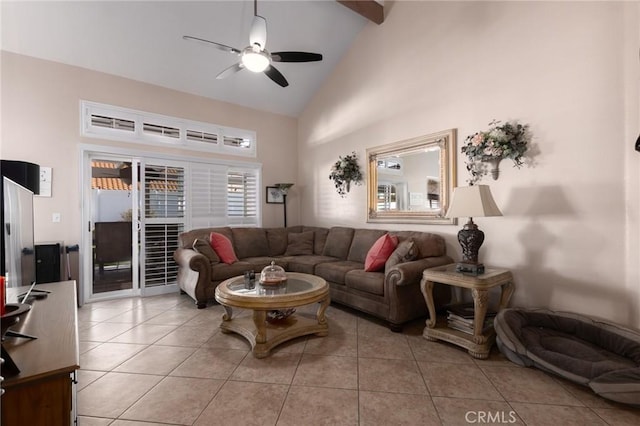 living room with light tile patterned floors, ceiling fan, and high vaulted ceiling