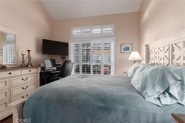 bedroom featuring vaulted ceiling