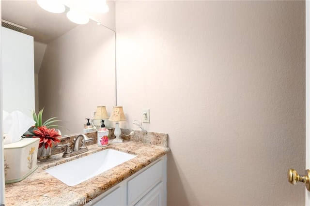 bathroom featuring visible vents and vanity