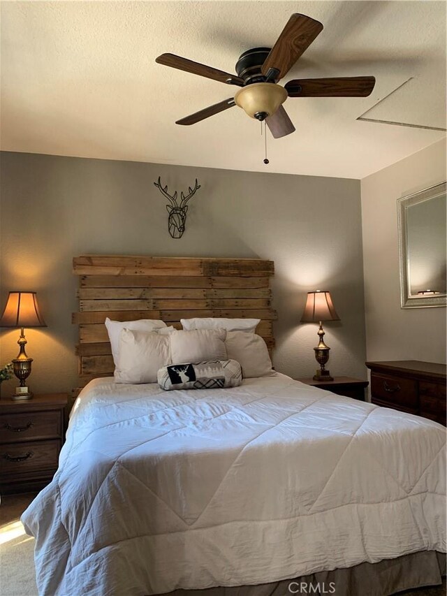 33492 Wild Rose Dr, Green Valley Lake, CA 92341 - bedroom featuring a textured ceiling, ceiling fan, and carpet