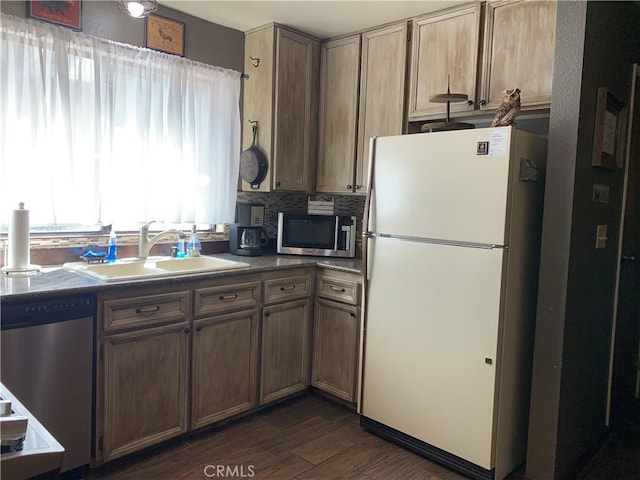 33492 Wild Rose Dr, Green Valley Lake, CA 92341 - kitchen featuring dark wood finished floors, stainless steel appliances, dark countertops, tasteful backsplash, and a sink