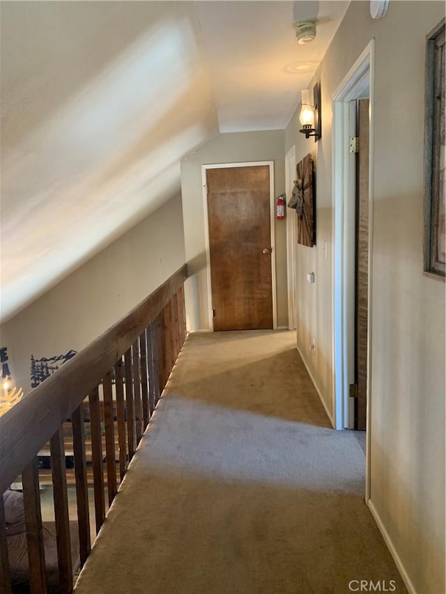33492 Wild Rose Dr, Green Valley Lake, CA 92341 - hallway with vaulted ceiling and carpet flooring