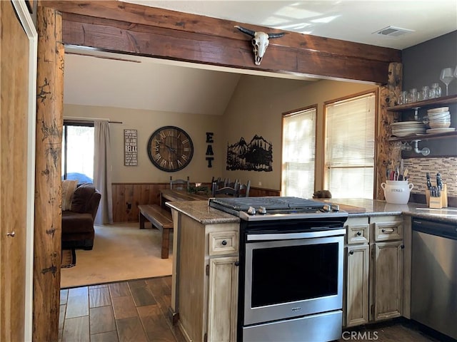 33492 Wild Rose Dr, Green Valley Lake, CA 92341 - kitchen featuring visible vents, dark wood finished floors, lofted ceiling with beams, appliances with stainless steel finishes, and a peninsula