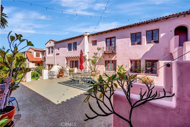 view of patio / terrace with a balcony