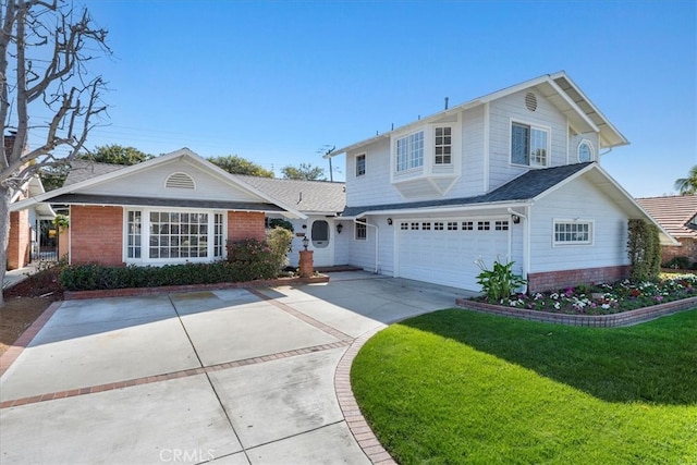 traditional home featuring a garage, a front yard, brick siding, and driveway