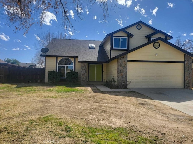 view of front facade with stone siding, fence, a front lawn, and concrete driveway