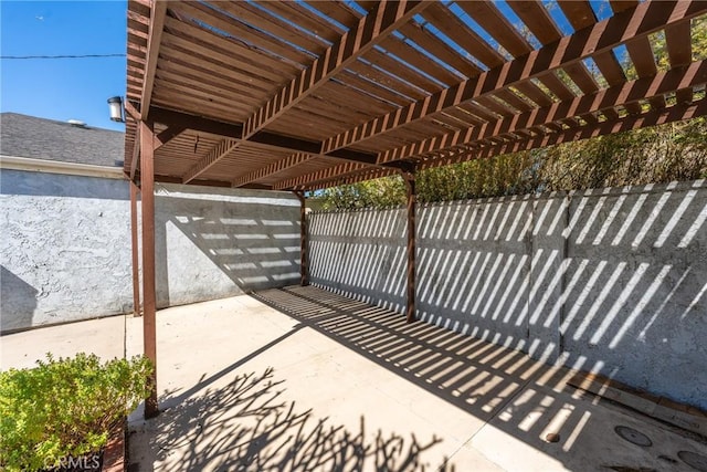 view of patio / terrace with fence and a pergola