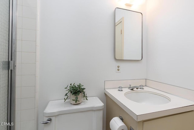 bathroom with toilet and vanity