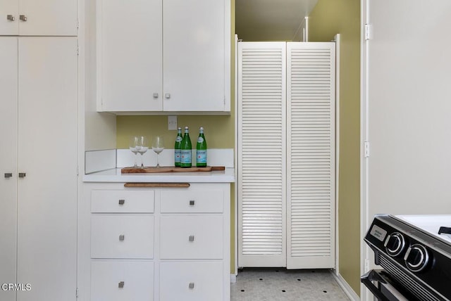 kitchen featuring white cabinets and light countertops