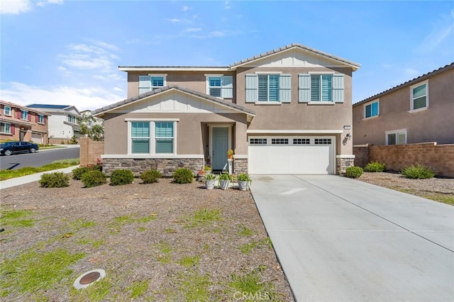 view of front of home featuring stone siding, concrete driveway, an attached garage, and stucco siding