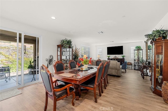 dining area featuring light wood-style floors, plenty of natural light, visible vents, and recessed lighting