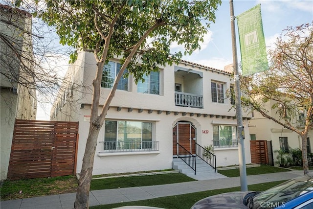 mediterranean / spanish home with stucco siding