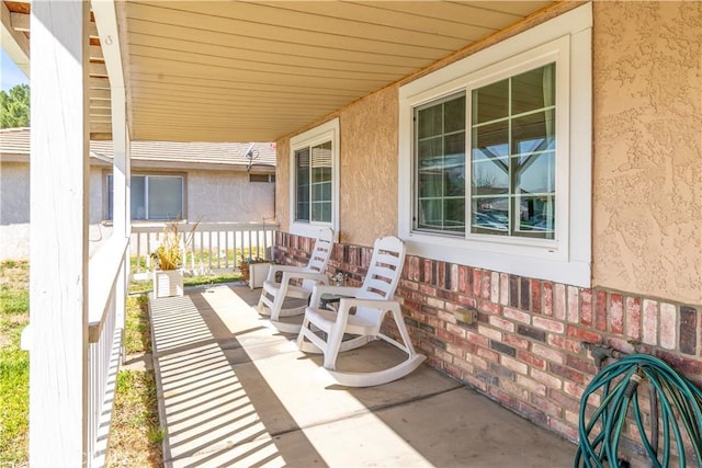 view of patio featuring a porch