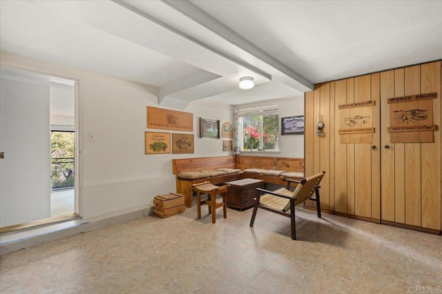 dining room with breakfast area and beam ceiling