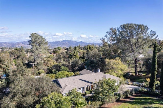 bird's eye view featuring a wooded view