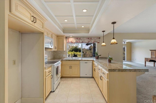 kitchen with light brown cabinetry, ornamental molding, white appliances, coffered ceiling, and a peninsula