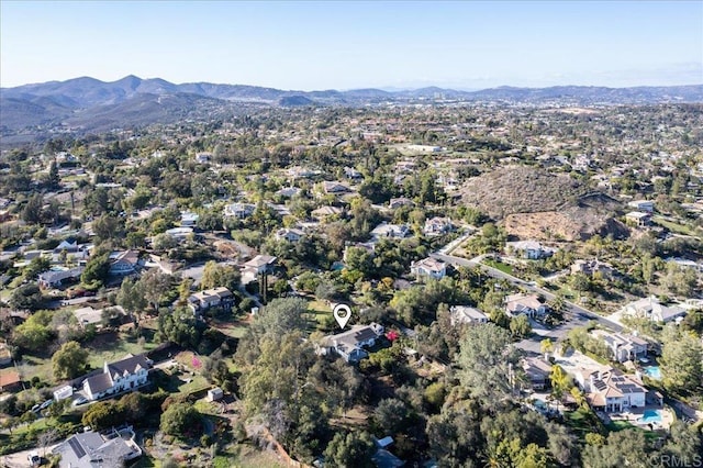 birds eye view of property with a mountain view