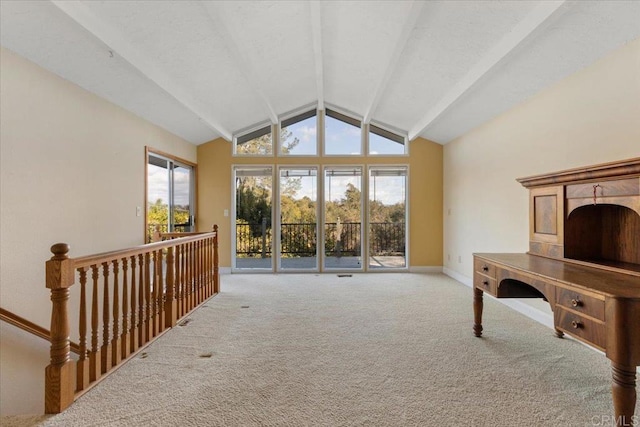 interior space featuring vaulted ceiling with beams, carpet, and baseboards