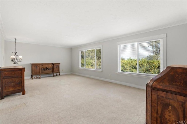 living area with an inviting chandelier, baseboards, ornamental molding, and light colored carpet