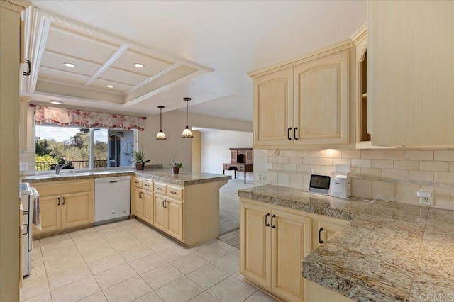 kitchen featuring decorative backsplash, range, dishwasher, a peninsula, and light brown cabinetry