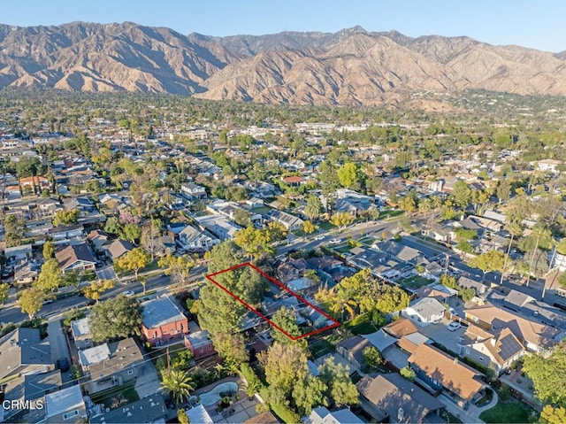 birds eye view of property featuring a mountain view and a residential view