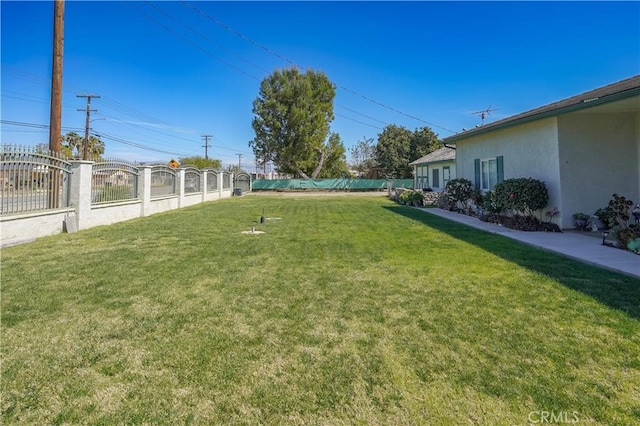 view of yard with fence