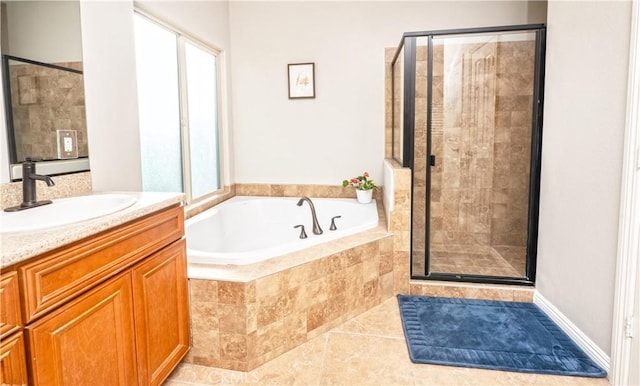 bathroom with a healthy amount of sunlight, a shower stall, and a bath