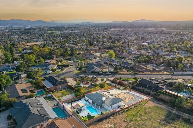 aerial view at dusk with a mountain view