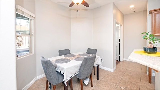 dining space featuring light tile patterned floors, baseboards, a ceiling fan, and recessed lighting