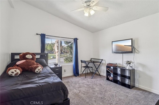 bedroom with baseboards, lofted ceiling, ceiling fan, carpet, and a textured ceiling