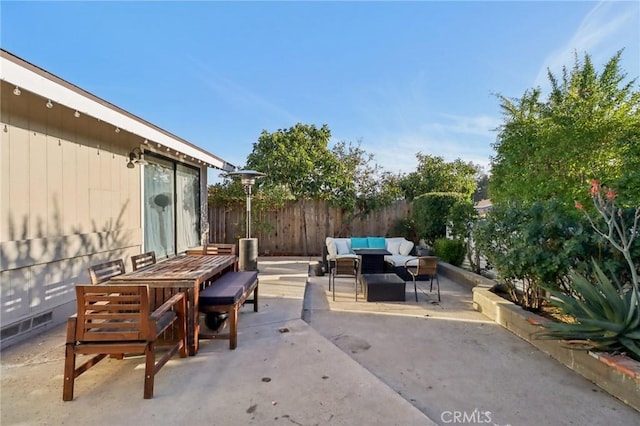 view of patio / terrace featuring outdoor dining space, outdoor lounge area, and fence