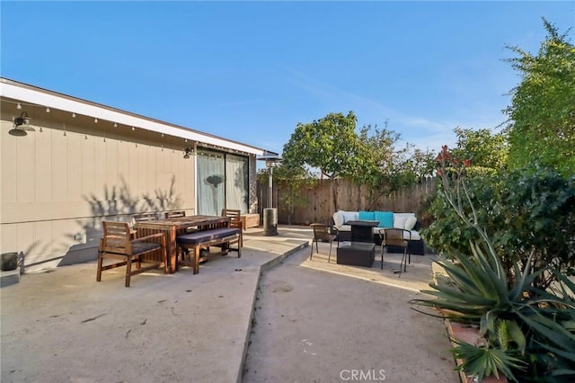 view of patio / terrace with fence and an outdoor hangout area