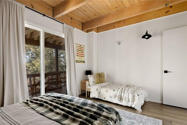 bedroom featuring wooden ceiling, access to outside, beamed ceiling, and wood finished floors