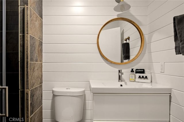 bathroom featuring toilet and vanity