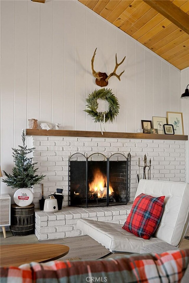 interior space featuring wooden ceiling, a fireplace, and beam ceiling