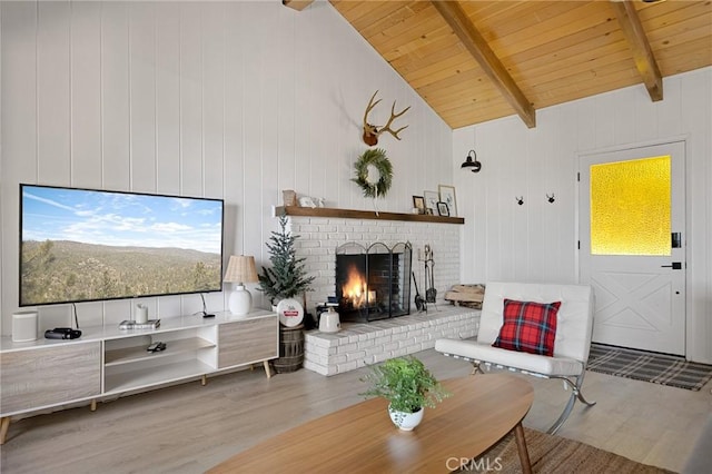 living room featuring a brick fireplace, wooden ceiling, vaulted ceiling with beams, and wood finished floors