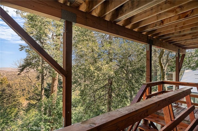 deck featuring a forest view