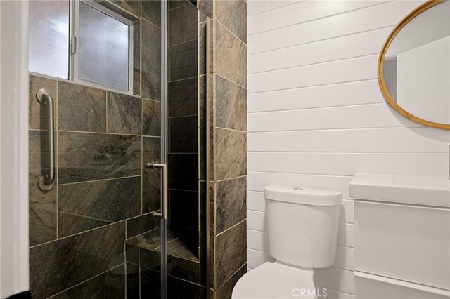 full bath with a shower stall and toilet