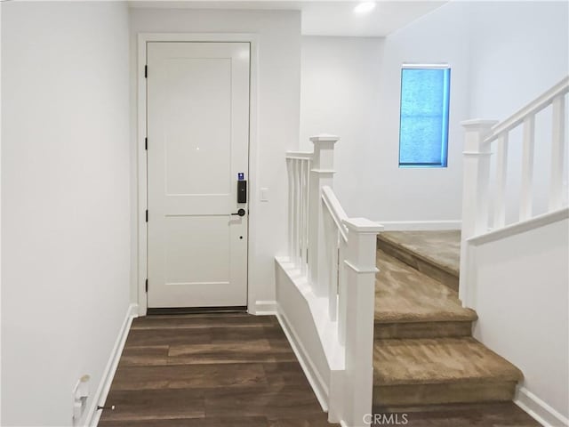 stairs with recessed lighting, baseboards, and wood finished floors